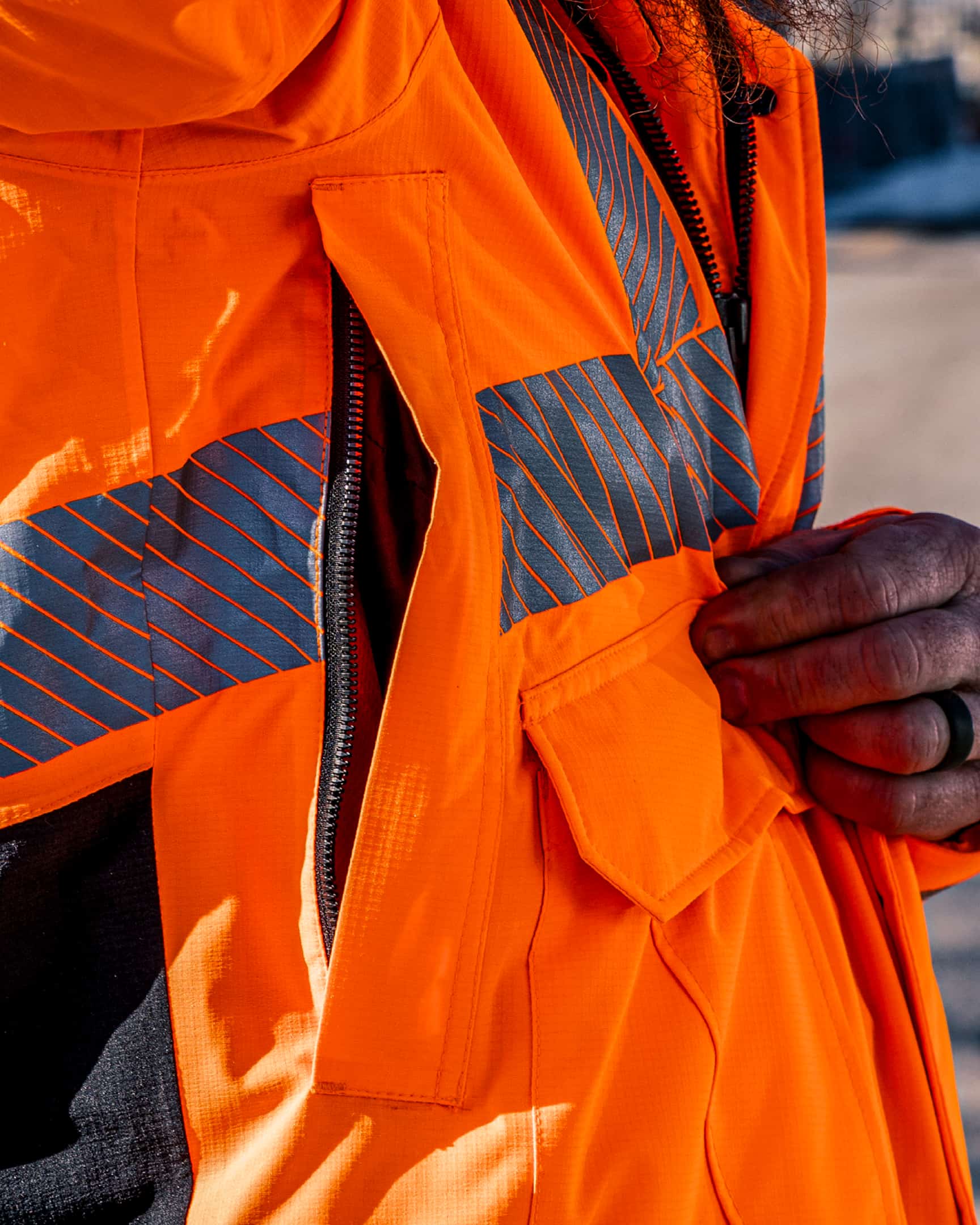 Vohl Hi Vis Waterproof Insulated Jacket – Safety Orange – SKU HV-IJ-205, lifestyle closeup | color:safety-orange