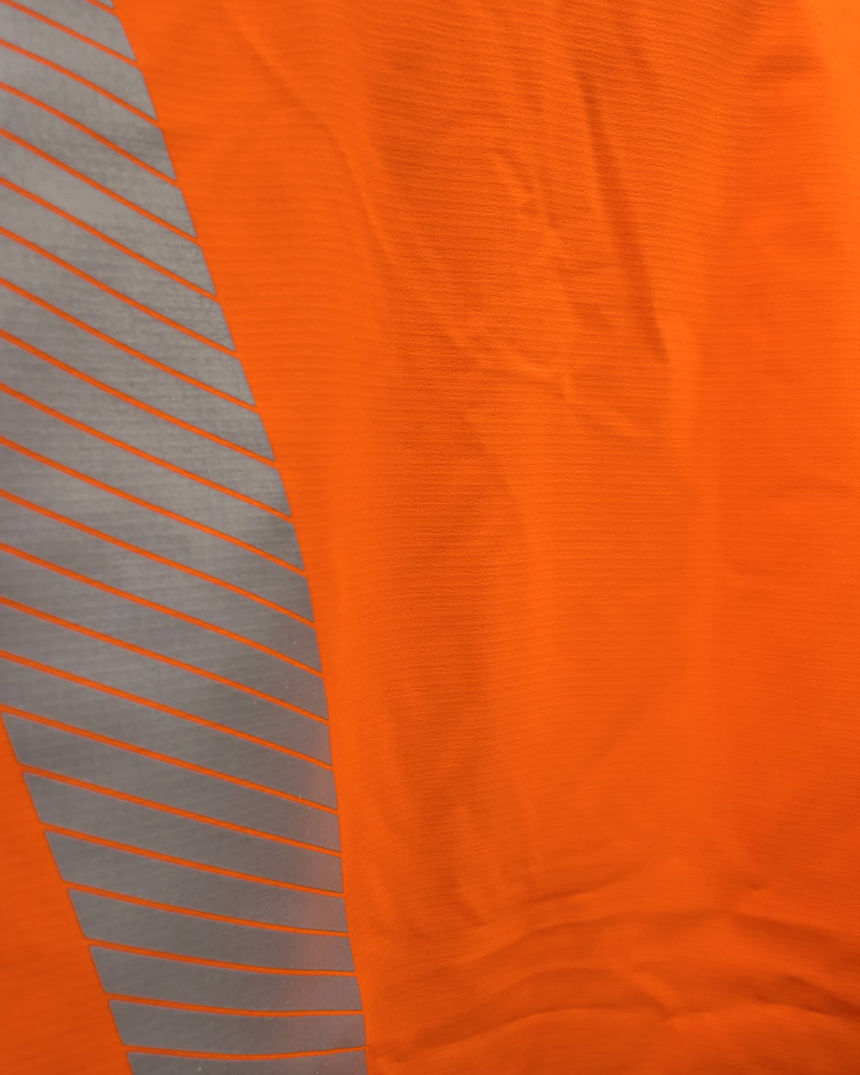 Vohl Hi Vis Waterproof Shell Jacket - Safety Orange - SKU HV-SJ-205, waterproof ripstop fabric close-up with reflective print detail | color:safety-orange