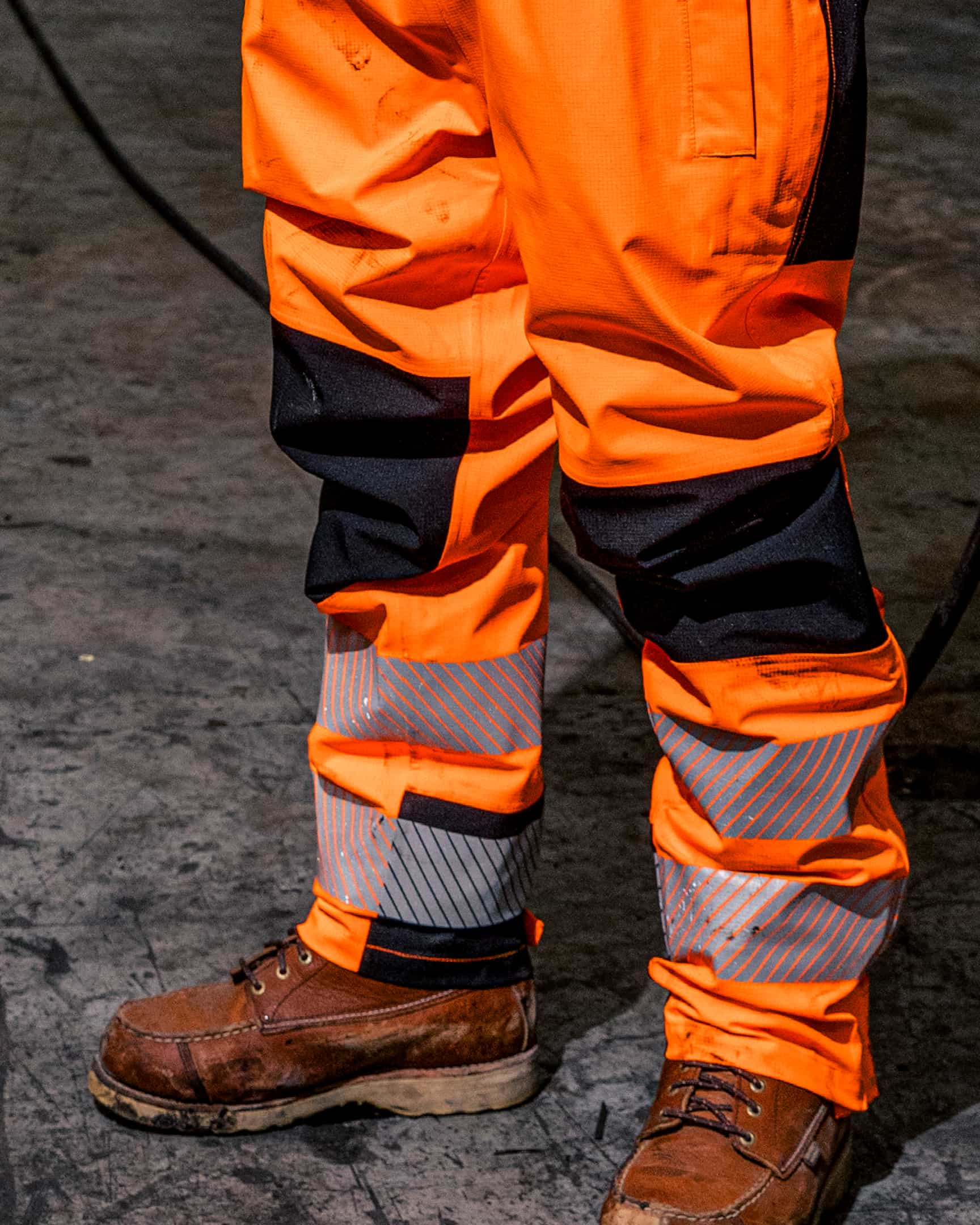 Vohl Hi Vis Waterproof Shell Pant – Safety Orange – SKU HV-SP-205, lifestyle closeup | color:safety-orange