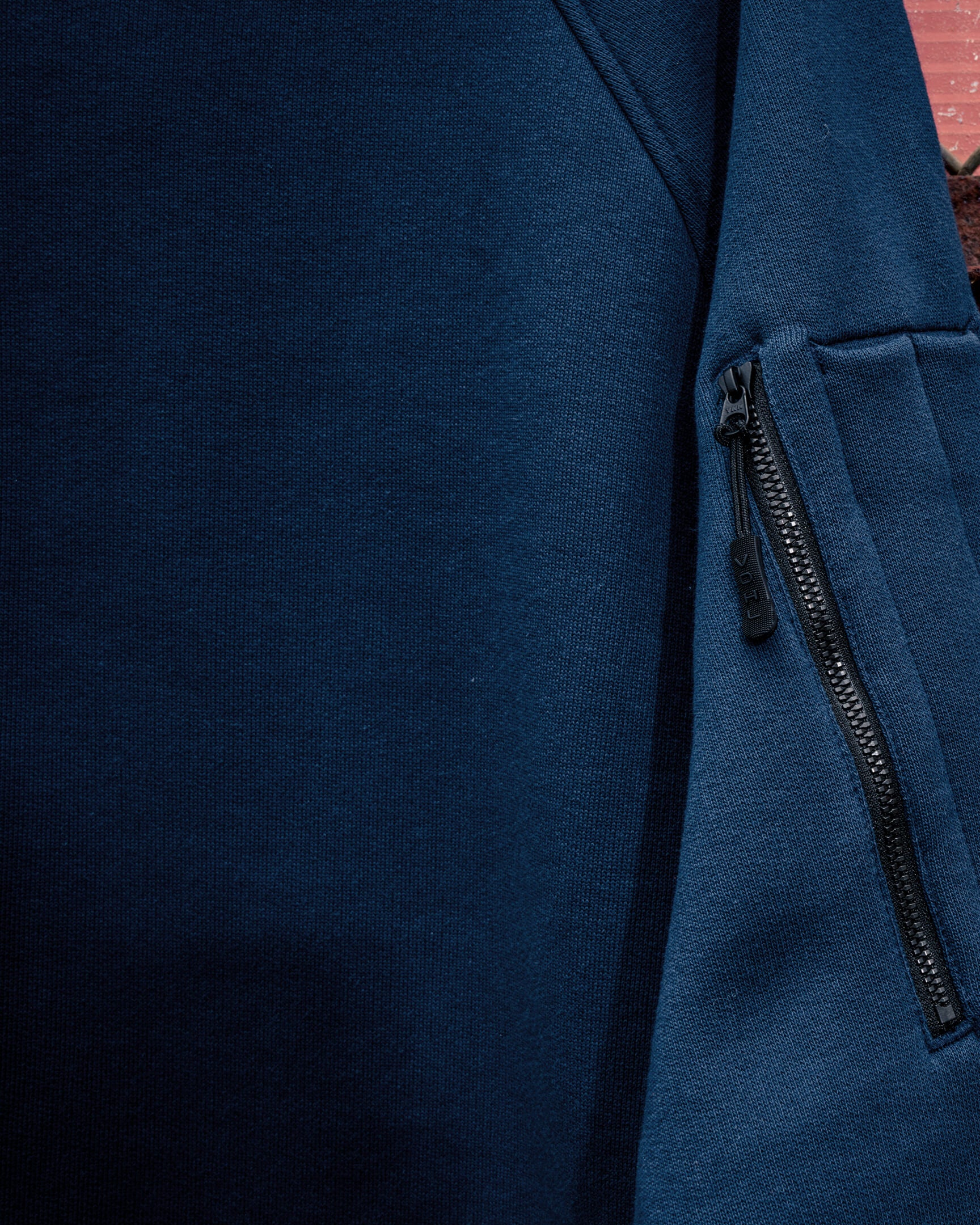 VOHL Heavyweight Fleece Hoody – Detroit Blue highlighting the concealed sleeve zip pocket and premium fleece fabric | color:detroit-blue