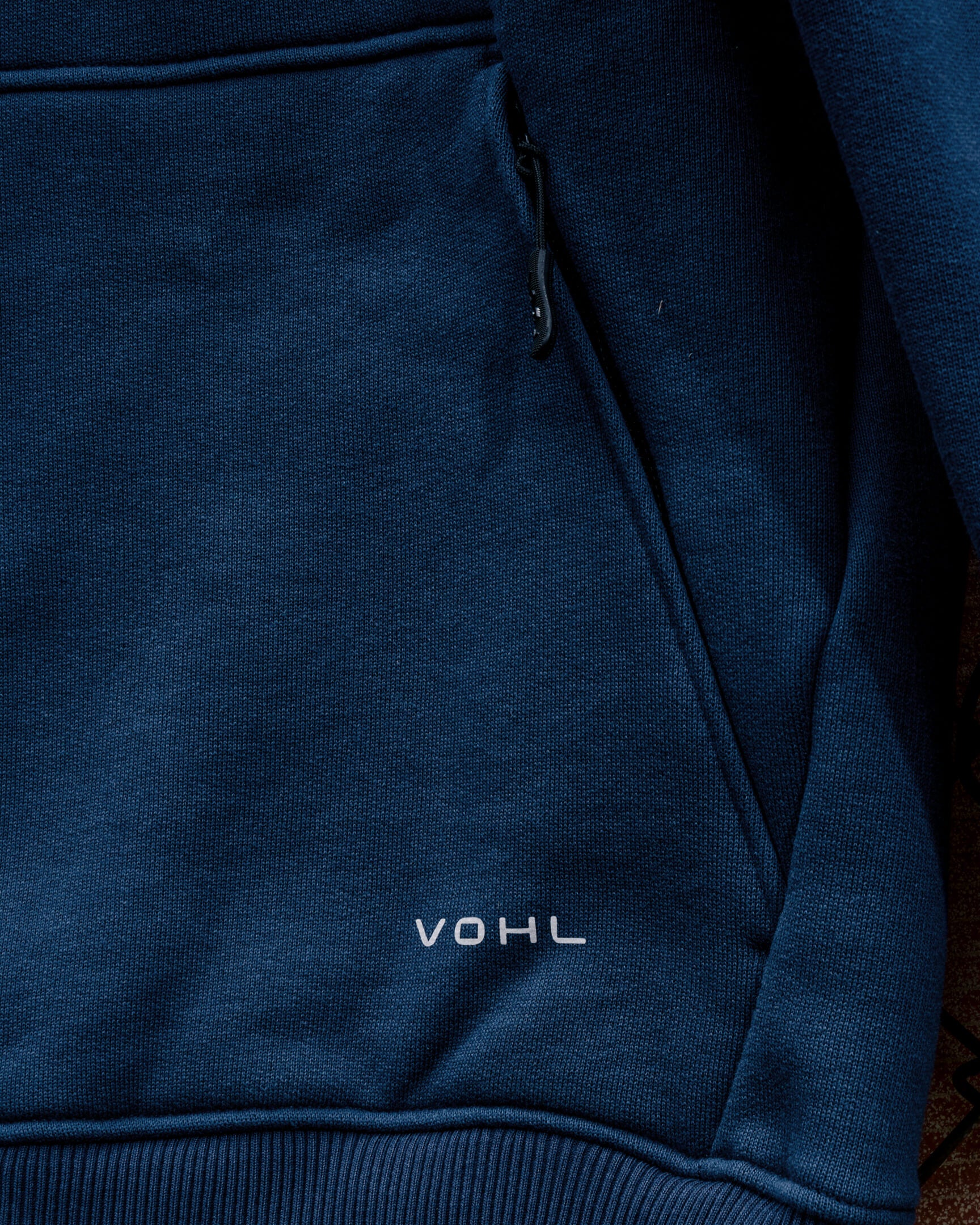 VOHL Heavyweight Fleece Hoody – Detroit Blue showing the front kangaroo pocket and logo detail | color:detroit-blue